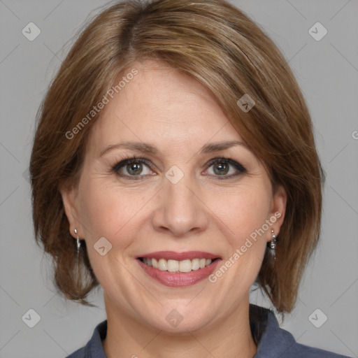 Joyful white adult female with medium  brown hair and grey eyes