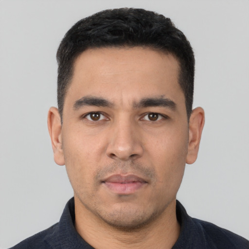 Neutral white young-adult male with short  black hair and brown eyes