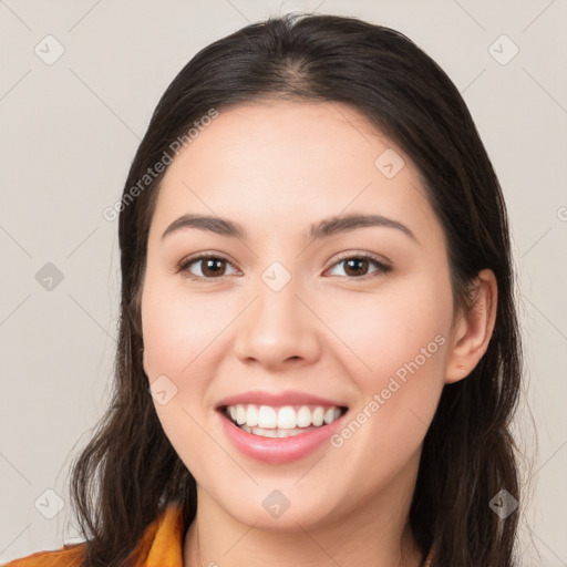 Joyful white young-adult female with long  brown hair and brown eyes