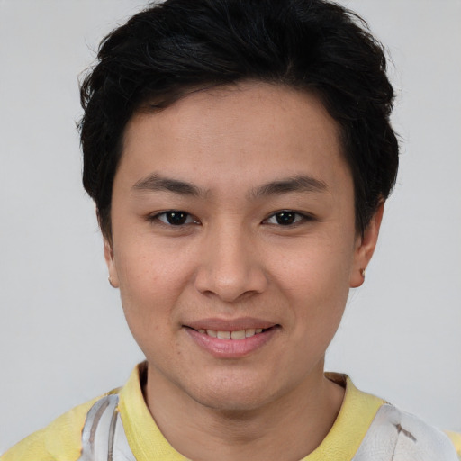 Joyful asian young-adult female with short  brown hair and brown eyes