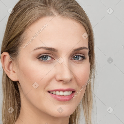 Joyful white young-adult female with long  brown hair and blue eyes