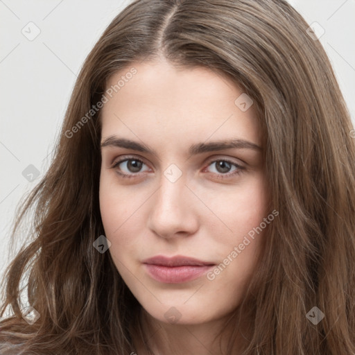 Neutral white young-adult female with long  brown hair and brown eyes