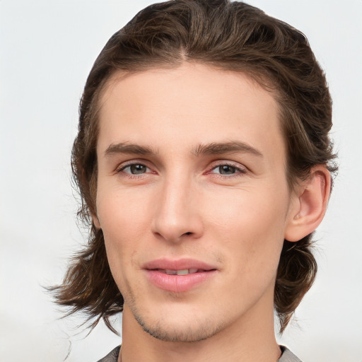 Joyful white young-adult male with medium  brown hair and brown eyes