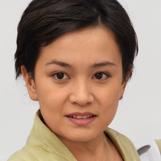 Joyful asian young-adult female with medium  brown hair and brown eyes