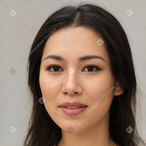 Joyful asian young-adult female with long  brown hair and brown eyes