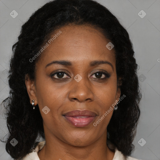 Joyful black adult female with medium  brown hair and brown eyes