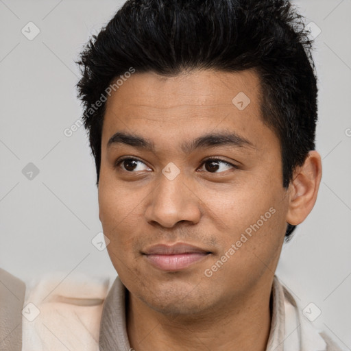 Joyful white young-adult male with short  black hair and brown eyes