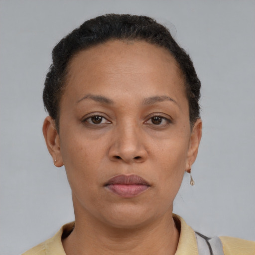 Neutral latino adult female with short  brown hair and brown eyes