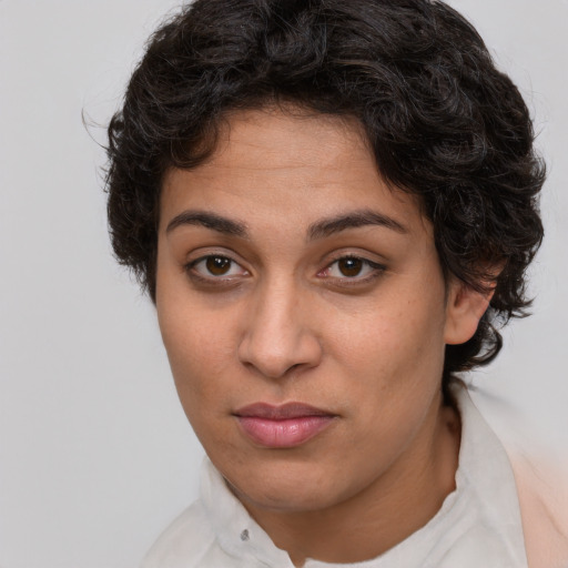 Joyful white adult female with short  brown hair and brown eyes