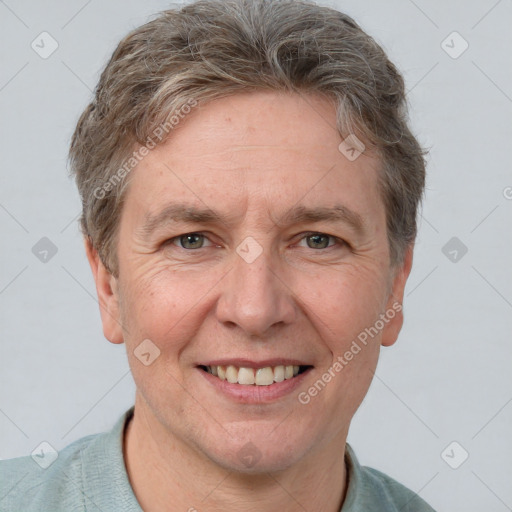 Joyful white adult male with short  brown hair and grey eyes