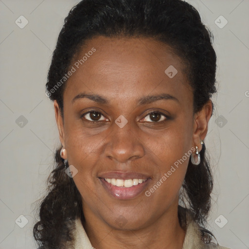 Joyful black adult female with medium  brown hair and brown eyes