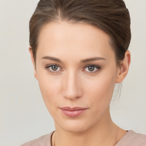 Neutral white young-adult female with medium  brown hair and brown eyes