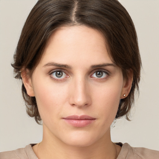 Neutral white young-adult female with medium  brown hair and brown eyes