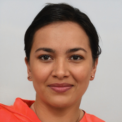 Joyful latino young-adult female with short  brown hair and brown eyes