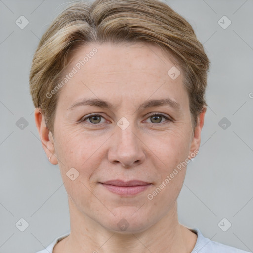 Joyful white adult female with short  brown hair and grey eyes