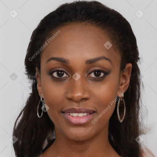 Joyful black young-adult female with long  brown hair and brown eyes