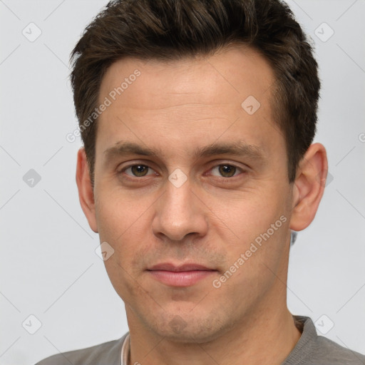 Joyful white young-adult male with short  brown hair and brown eyes