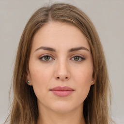 Neutral white young-adult female with long  brown hair and brown eyes