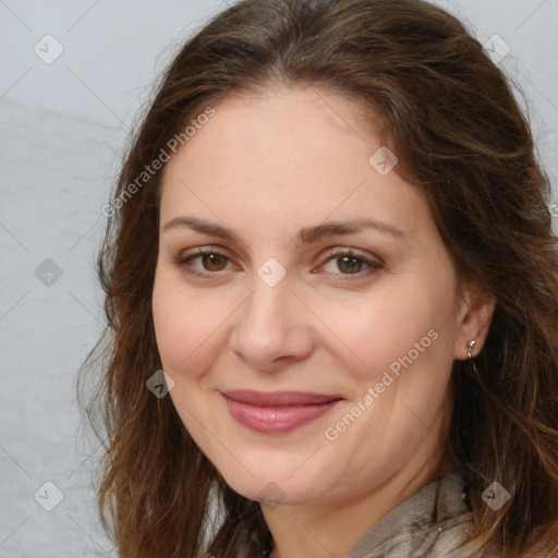 Joyful white adult female with long  brown hair and brown eyes