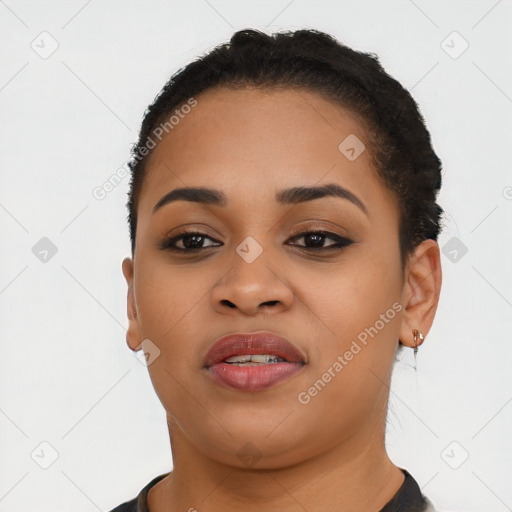 Joyful latino young-adult female with short  black hair and brown eyes