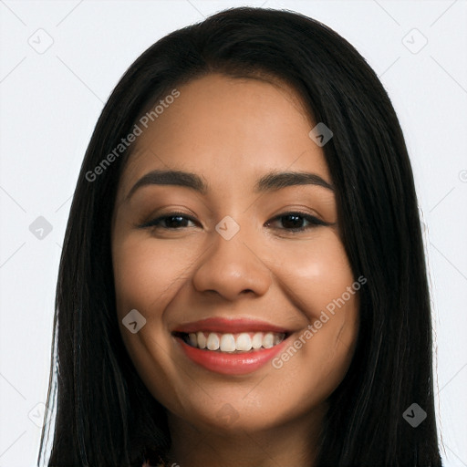 Joyful latino young-adult female with long  black hair and brown eyes