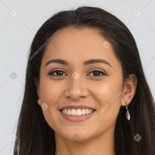 Joyful latino young-adult female with long  brown hair and brown eyes