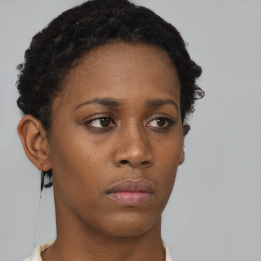 Neutral black young-adult female with short  black hair and brown eyes