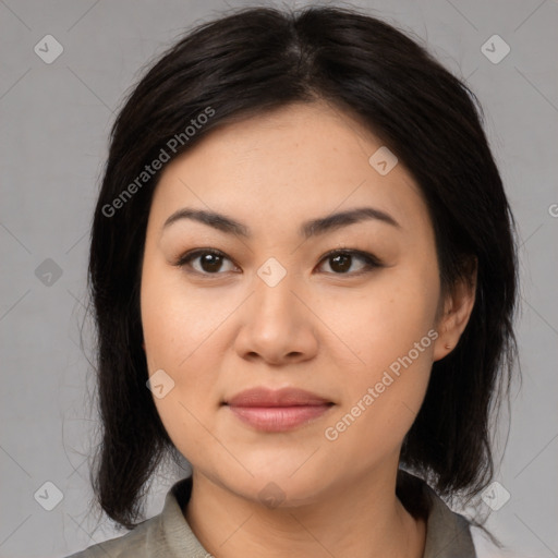 Joyful asian young-adult female with medium  black hair and brown eyes