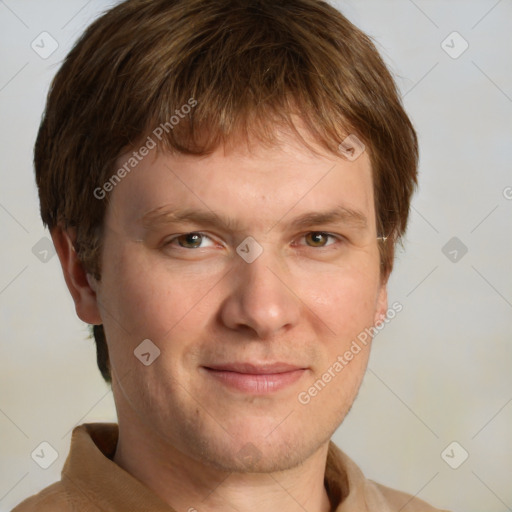 Joyful white adult male with short  brown hair and grey eyes