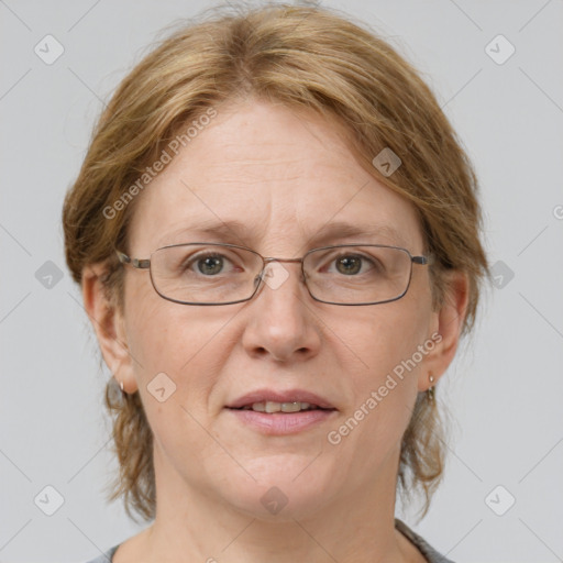 Joyful white adult female with medium  brown hair and grey eyes