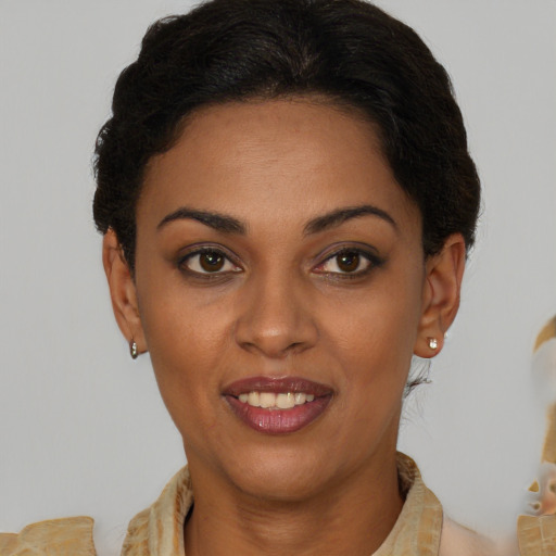 Joyful latino young-adult female with short  brown hair and brown eyes