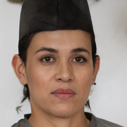 Joyful white young-adult female with short  black hair and brown eyes