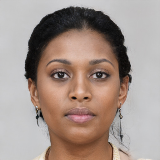 Neutral black young-adult female with short  black hair and brown eyes