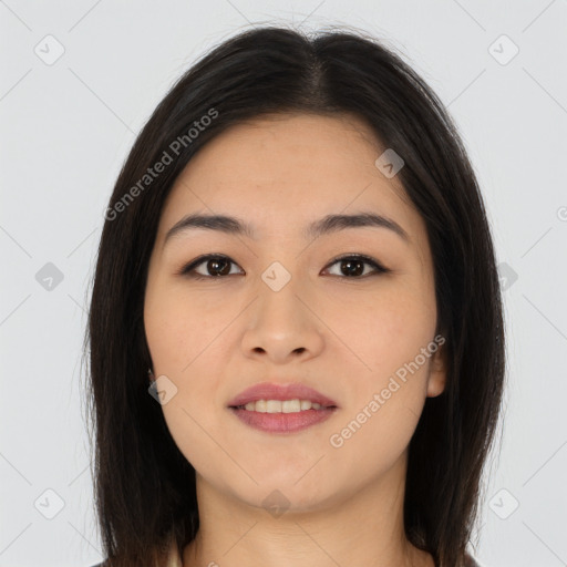 Joyful asian young-adult female with long  brown hair and brown eyes