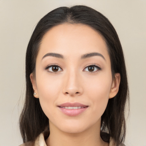 Joyful asian young-adult female with long  brown hair and brown eyes