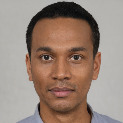 Neutral black young-adult male with short  black hair and brown eyes