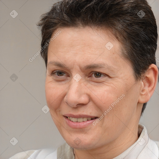 Joyful white adult female with short  brown hair and brown eyes