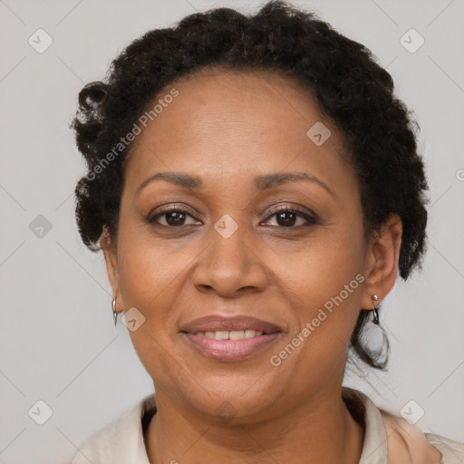 Joyful black adult female with short  brown hair and brown eyes