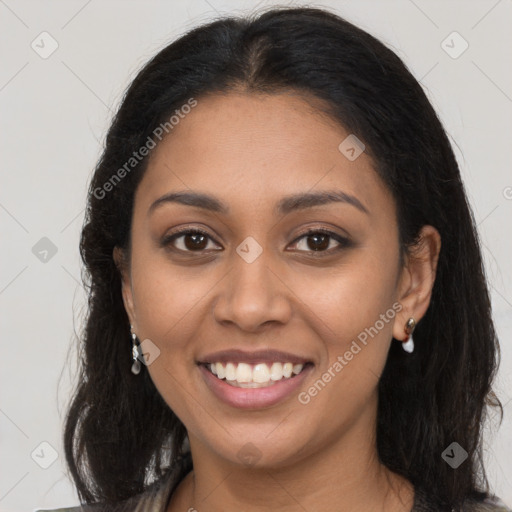 Joyful latino young-adult female with long  brown hair and brown eyes