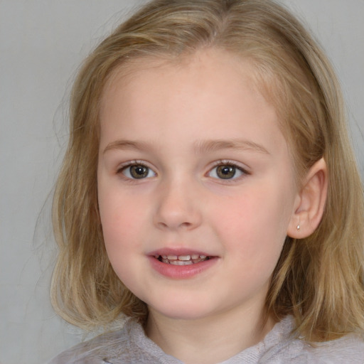 Joyful white child female with medium  brown hair and blue eyes