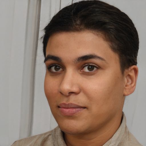Joyful latino young-adult female with short  brown hair and brown eyes