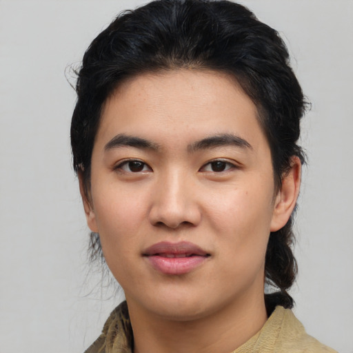 Joyful asian young-adult female with medium  black hair and brown eyes
