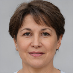 Joyful white adult female with short  brown hair and brown eyes