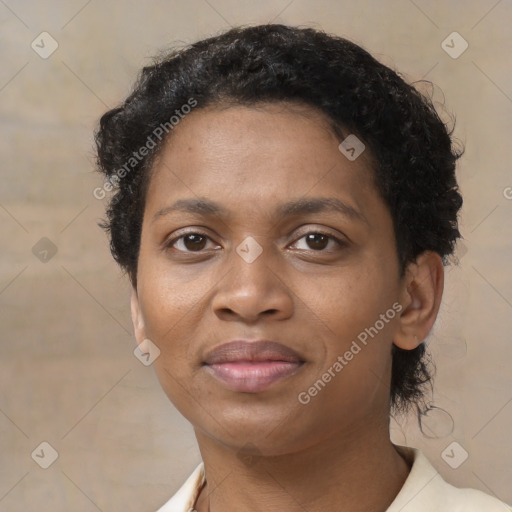 Joyful black adult female with short  brown hair and brown eyes