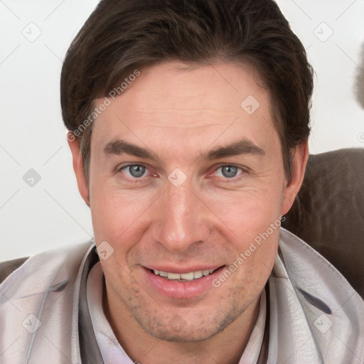 Joyful white adult male with short  brown hair and grey eyes