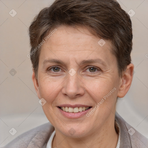 Joyful white adult female with short  brown hair and brown eyes