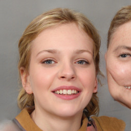 Joyful white young-adult female with medium  brown hair and blue eyes