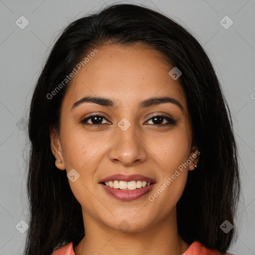 Joyful latino young-adult female with long  brown hair and brown eyes