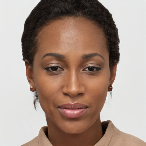 Joyful black young-adult female with short  brown hair and brown eyes