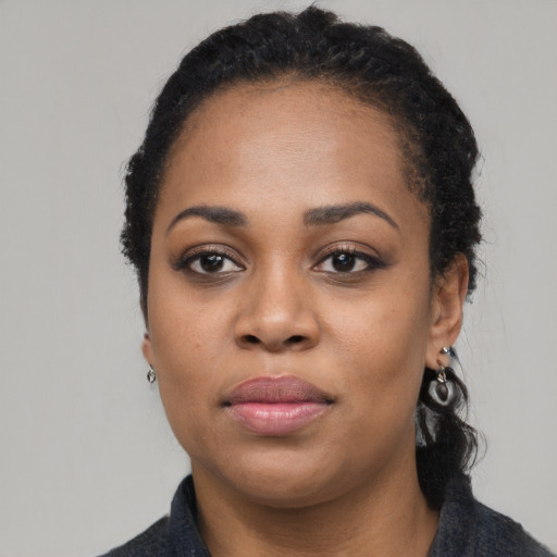 Neutral black young-adult female with long  black hair and brown eyes